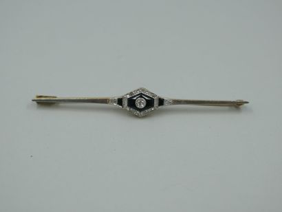 null An 18k yellow gold and platinum brooch with a quadrangular design centered on...