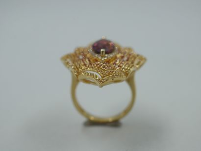 null An important 18k yellow gold openwork marquise ring set with a navette-cut tourmaline...
