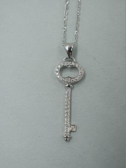 null Key pendant in 18k white gold paved with diamonds. PB : 1,75gr. Dimensions of...