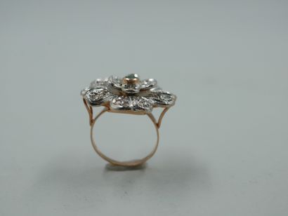 null 
A 14k yellow gold and silver flower ring centered on an emerald and paved with...