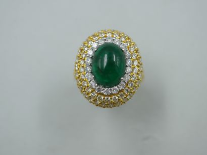 null An 18k yellow gold pompadour ring with a 4ct cabochon emerald surrounded by...