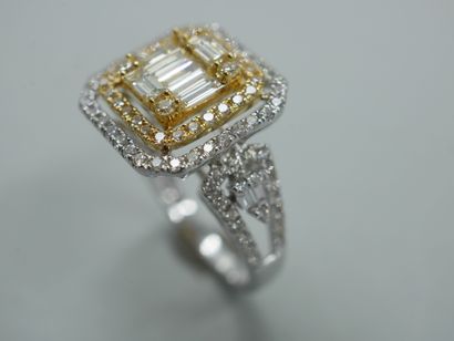 null An 18k yellow and white gold openwork rectangular ring set with baguette-cut...