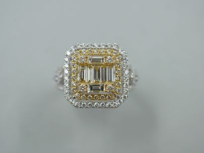 null An 18k yellow and white gold openwork rectangular ring set with baguette-cut...