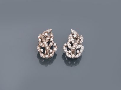 A pair of 18k white gold earrings with an...