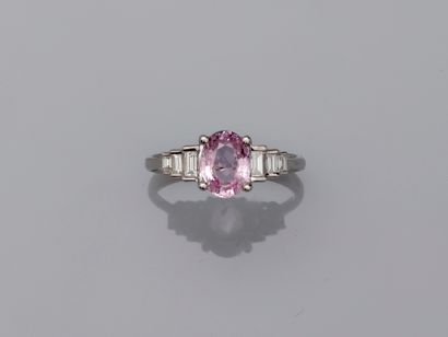 18k white gold ring set with an oval pink...