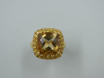 An 18k yellow gold ring set with a briolette-cut...