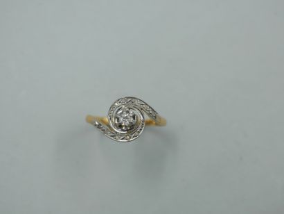 null 18k yellow gold and platinum tourbillon ring with a brilliant-cut diamond set...