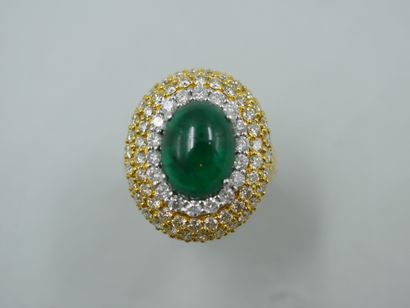 null An 18k yellow gold pompadour ring with a 4ct cabochon emerald surrounded by...