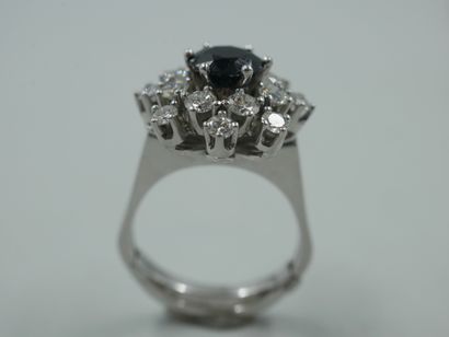 null 18k white gold flake ring with a round sapphire of 1.20ct in a diamond setting....