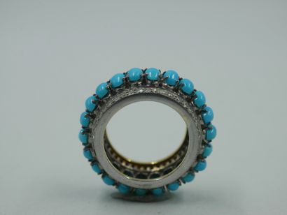 null 
Ring in the ethnic style in silver set with oval turquoise cabochons between...