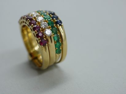 null Multiple ring in 18k yellow gold composed of four rings set with a line of rubies,...