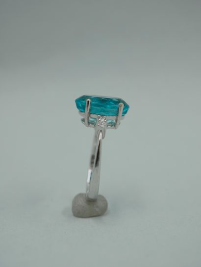 null An 18K white gold ring set with a 3.96ct natural oval apatite and diamonds....