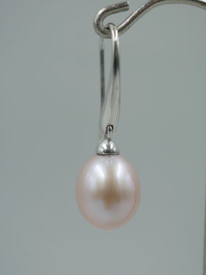 null A pair of 18K white gold earrings set with pink piriform cultured pearls of...