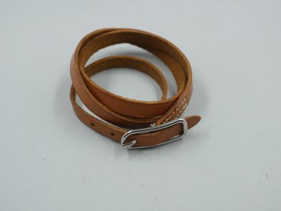 null HERMES Paris. Light brown leather bracelet, silver plated clasp. Length 68,5cm....