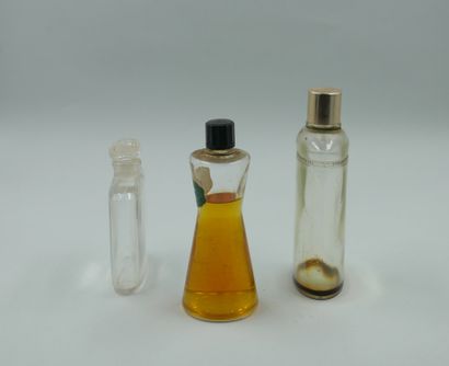 null Set of three bottles including Caron "N'aimez que moi", empty. Gilded stopper....