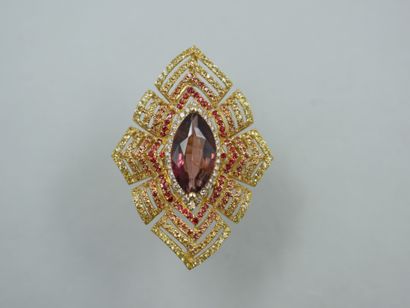 null An important 18k yellow gold openwork marquise ring set with a navette-cut tourmaline...