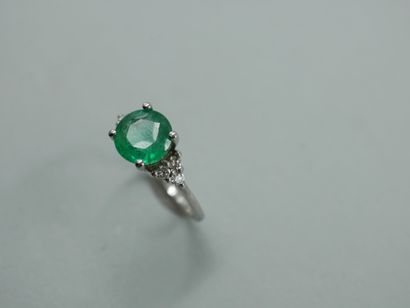 null 18k white gold ring set with a 2.01cts natural round emerald and 0.20cts of...