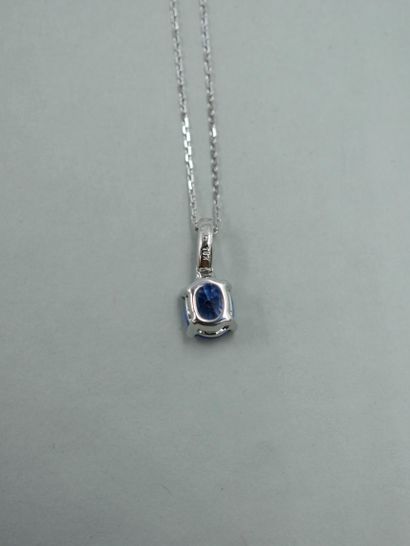 null 18K white gold pendant set with an oval sapphire weighing approximately 1.45cts,...