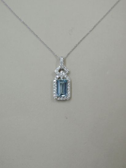 null 18k white gold necklace holding a rectangular pendant with an emerald-cut aquamarine...