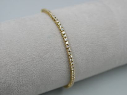 null Line bracelet in 18k yellow gold entirely paved with small brilliant-cut diamonds....