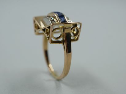 null 
18k yellow gold bridge ring set with a line of calibrated sapphires between...