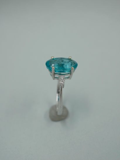 null An 18K white gold ring set with a 3.96ct natural oval apatite and diamonds....