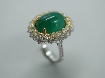 null An 18k white and yellow gold Pompadour-style ring set with a 6ct emerald cabochon...