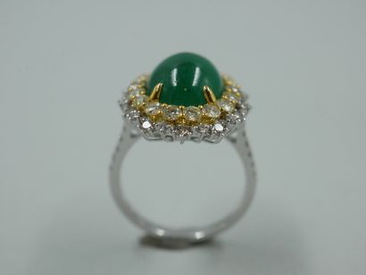 null An 18k white and yellow gold Pompadour-style ring set with a 6ct emerald cabochon...
