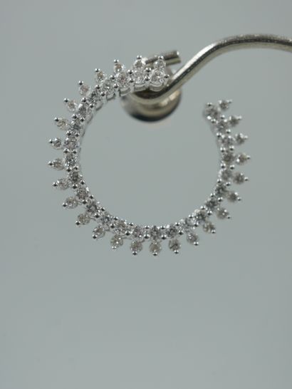 null Pair of 18k white gold stud earrings set with brilliant-cut diamonds. Diameter:...