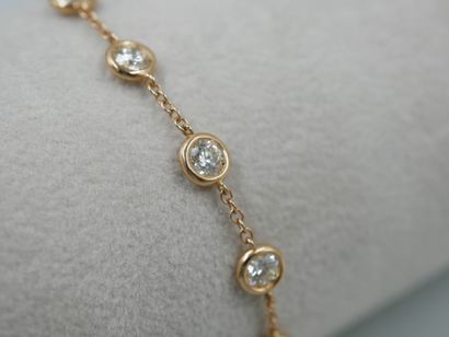 null 18k yellow gold bracelet with diamonds in closed setting weighing approximately...