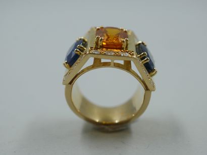 null An important 18k yellow gold Tank style ring set with an oval citrine weighing...