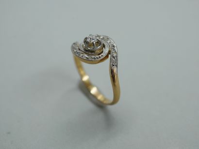 null 18k yellow gold and platinum tourbillon ring with a brilliant-cut diamond set...