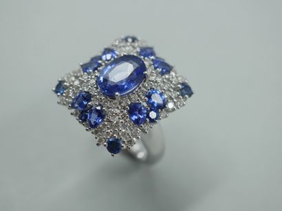 null An 18k white gold ring with a square bezel, set with a 2.20ct sapphire in a...