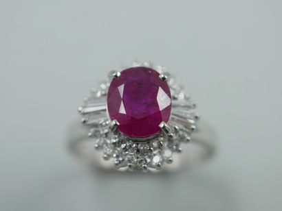null 
Platinum ring presenting a round ruby of 1,50cts approximately accosted by...