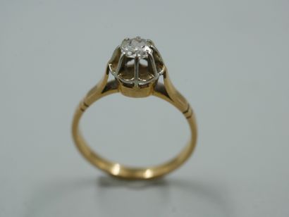 null 18k yellow and white gold solitaire ring set with a 0.25ct old cut diamond....
