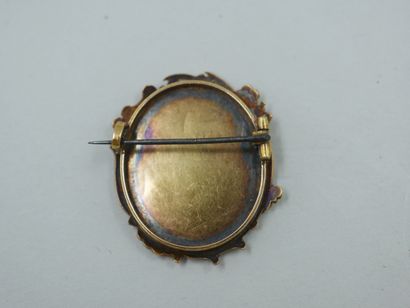 null An 18k yellow gold oval brooch with foliated edges comprising an 18th century...