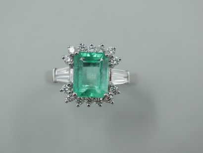 null An 18k white gold pompadour ring set with a 1.50ct emerald probably from Colombia...