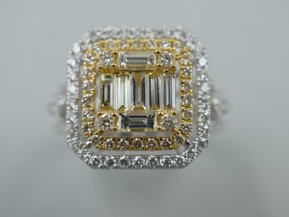 null An 18k yellow and white gold openwork rectangular ring set with baguette-cut...