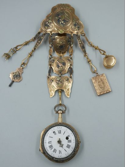 null Three gold chatelaine with chased decorations of quivers, masks, musical instruments...