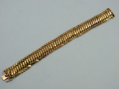 Bracelet en or jaune 18K à mailles américaines....