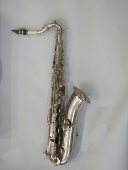Tenor saxophone brand Couesnon with its mouthpiece...