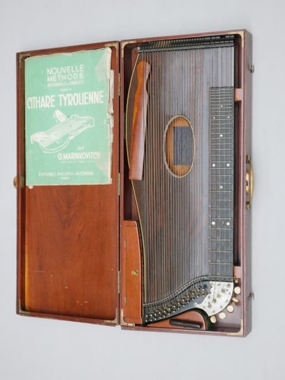 null Tyrolean zither ca. 1900, mounted on strings, in its mahogany box, with its...
