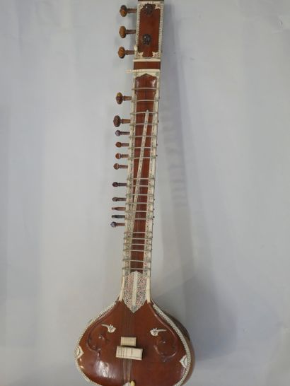 null Indian sitar mounted on strings, case repaired, in a case.

Sold as is.