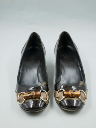 null GUCCI. 

Two pairs of ballerinas with small heel in black and brown patent leather....