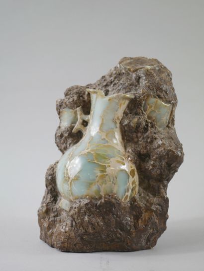 null Sculpture representing a vase held in stone. 

Glass and mixed technique. 

20th...