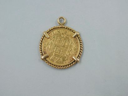 null Sovereign in 18k yellow gold, Victoria Dei Gratia. Year 1861. 

Mounted as a...