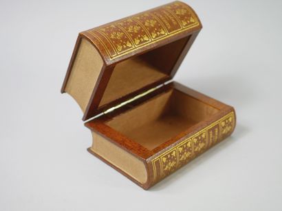 null Box with simulated books. A gilded stucco mirror with a ribbon pediment is attached....