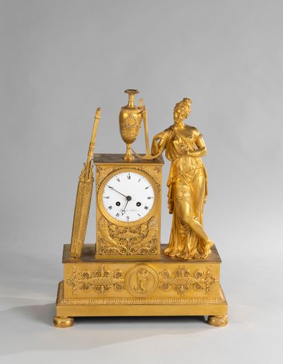 null Clock in the effigy of the Navy in chased gilt bronze representing a woman musician...