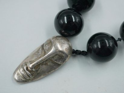 null Two necklaces, one in faceted agate beads, the other in black glass beads with...