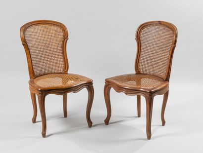null Pair of dark cane chairs in natural wood. Rounded backrest, curved belt, curved...